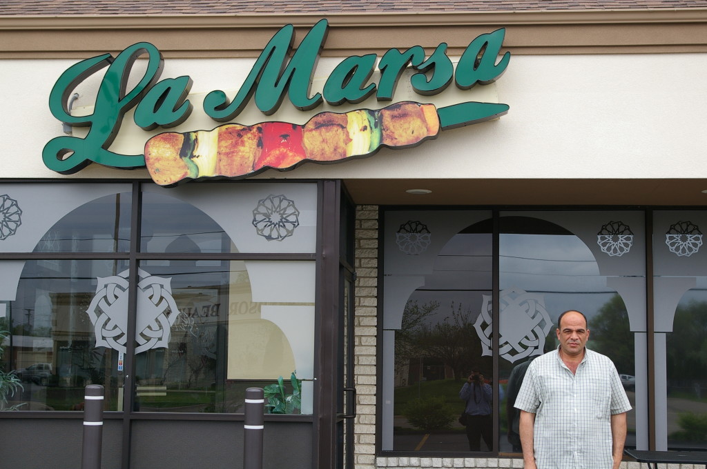 Mr. Ahmed, in front of one of his West Bloomfield locations. 