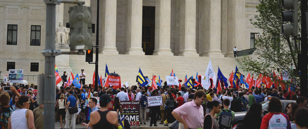 Outside the Supreme Court moments before the Obergefell decision was issued. Photo courtesy of Wikimedia Commons user Mattpopovich.